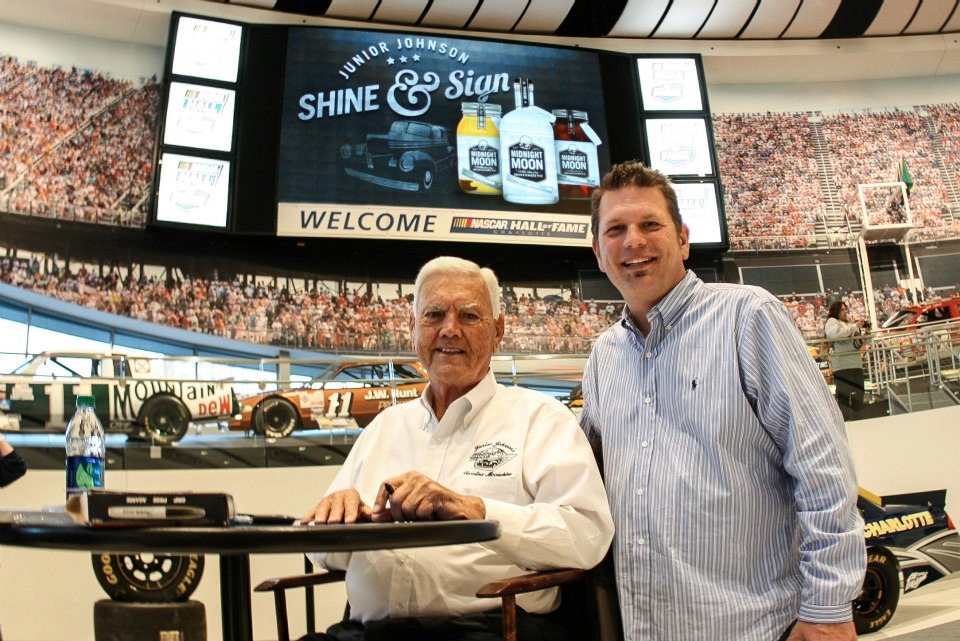 Junior Johnson loves to share Midnight Moon moonshine with his NASCAR fans.